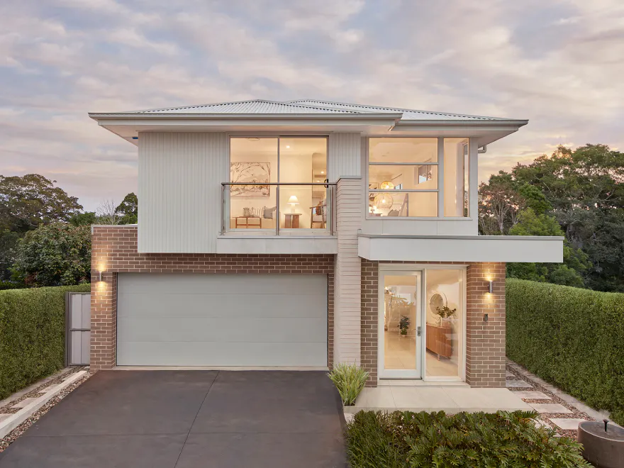 Double storey home exterior with brick and render