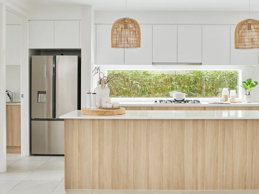 Kitchen with an island bench and window splashback